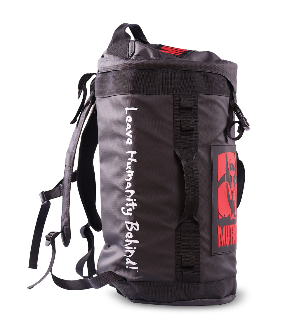 The lateral view of the black Military Top Load Duffel Backpack showcasing the 'MUTANT' tagline 'Leave Humanity Behind' in white letters, against a white background.
