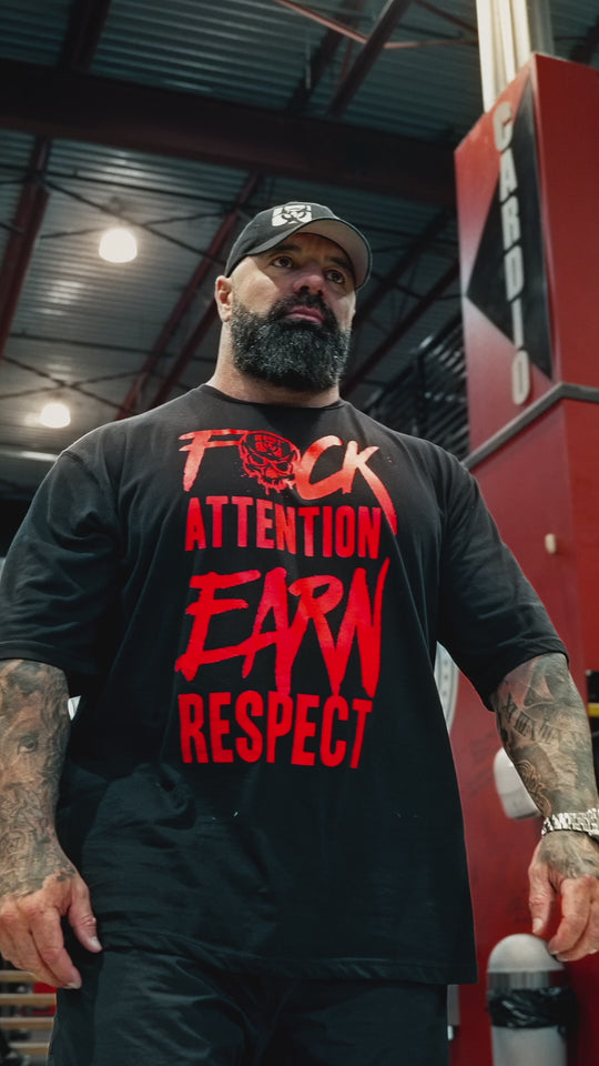 Video featuring Dusty Hanshaw, Mutant athlete, wearing the Black 'Dusty Says' Mutant Oversized Gym T-shirt. The video showcases the front and back views of the t-shirt, displaying Dusty's motto 'F*ck attention earn respect' in red on the front, and the phrase 'Time to earn it' with the Mutant logo in red on the back.